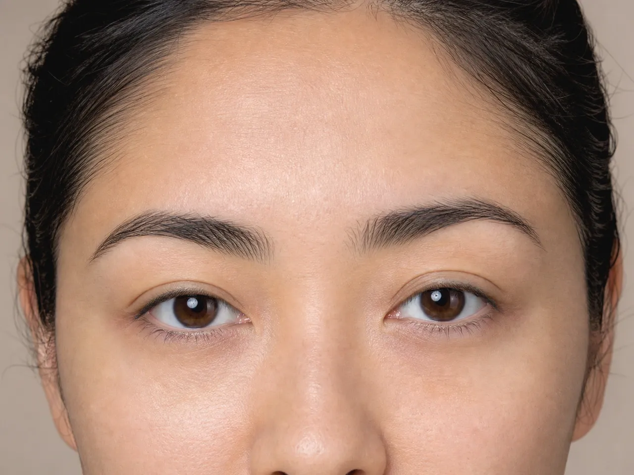 Step 1 of Soft Glam for Hooded Eyes, showing the lids feel smooth and dry while the natural fold and open-eye landmarks remain easy to see.