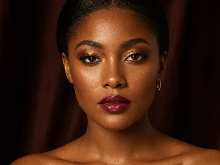 Step 1 of Holiday Party Shimmer Makeup, showing the skin and lids feel settled, even, and ready for thin layers without a slippery surface.