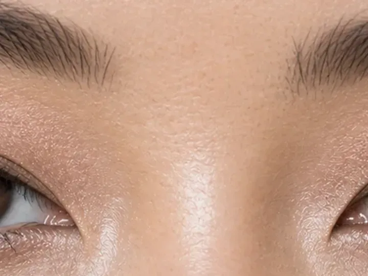 Step 2 of Lifted Makeup for Downturned Eyes, showing lift taupe creates a soft guide at outer lid angled upward that remains visible with a relaxed gaze.