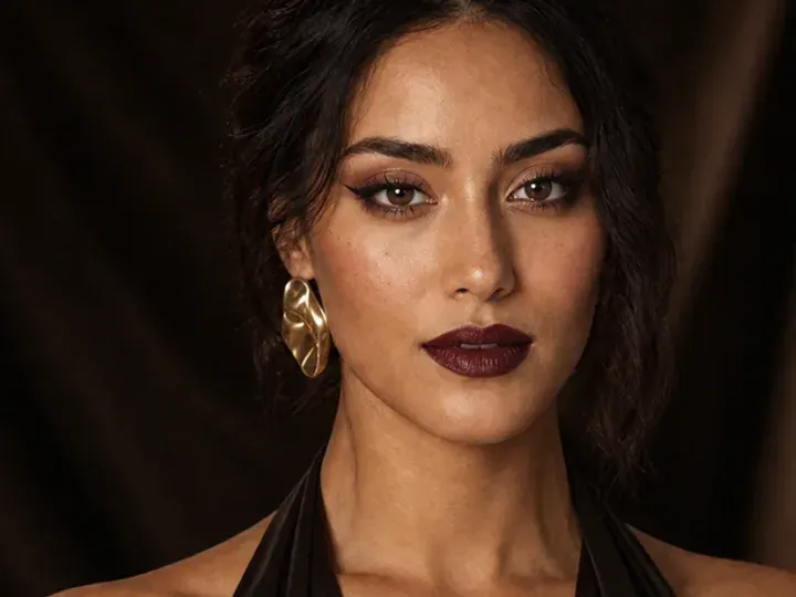 Step 2 of Elegant Dinner Party Makeup, showing discoloration is softened while natural skin remains visible around the perimeter of the face.
