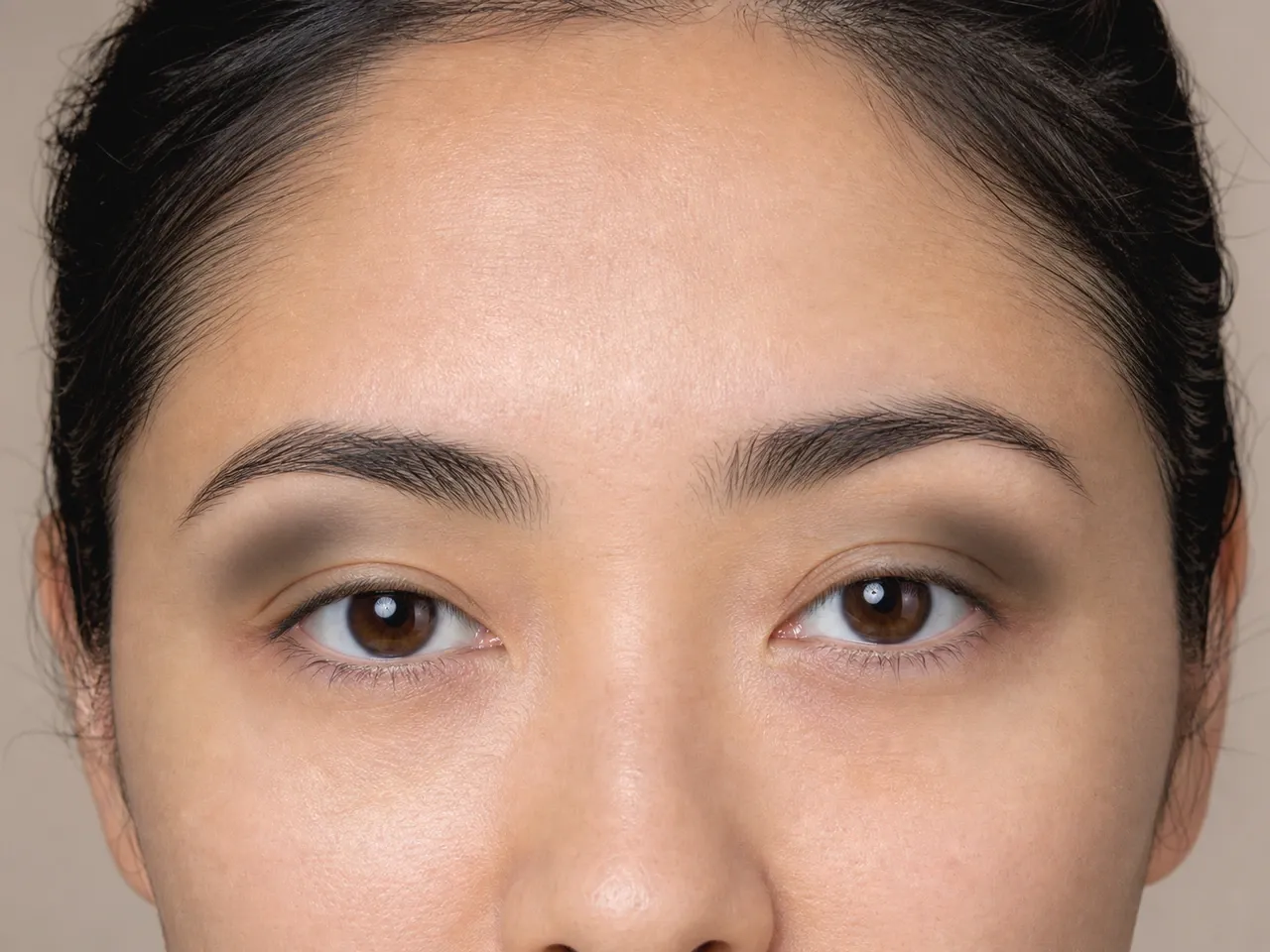 Step 3 of Soft Glam for Hooded Eyes, showing the outer structure is slightly deeper than the transition while the center lid remains available for the focal shade.