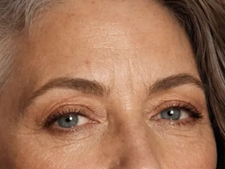Step 3 of Natural Makeup for Mature Skin, showing the brows look intentional but retain visible hairs and enough softness for the rest of the look.
