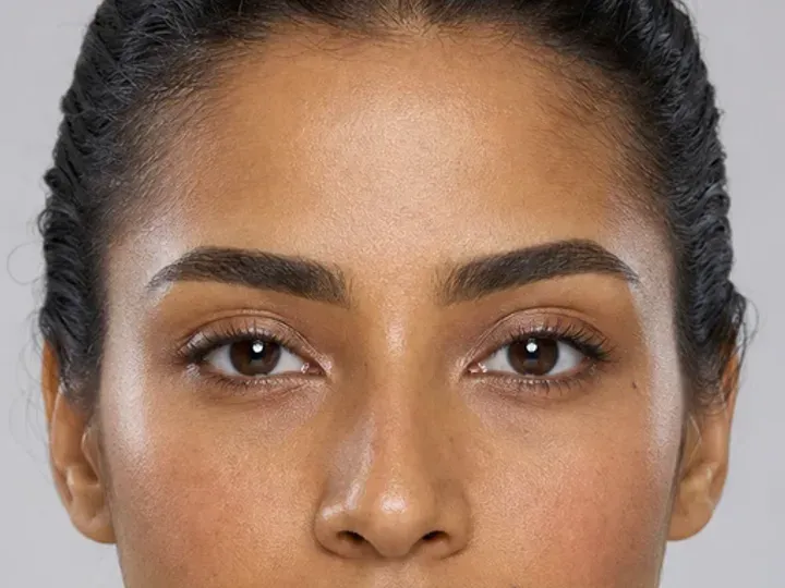Step 3 of Neutral Soft Glam for Olive Skin, showing the brows look intentional but retain visible hairs and enough softness for the rest of the look.