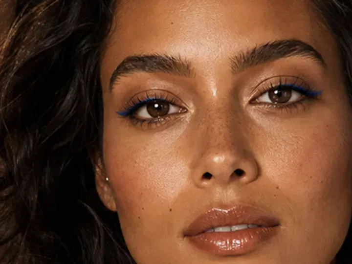 Step 4 of Easy Vacation Makeup, showing sheer bronze establishes the eye direction at lid and outer cheek without a hard outer edge.