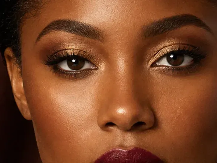 Step 4 of Holiday Party Shimmer Makeup, showing matte cranberry establishes the eye direction at outer lid and crease without a hard outer edge.