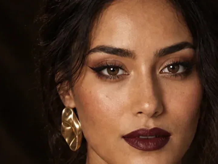 Step 4 of Elegant Dinner Party Makeup, showing soft plum establishes the eye direction at outer lid and lash line without a hard outer edge.