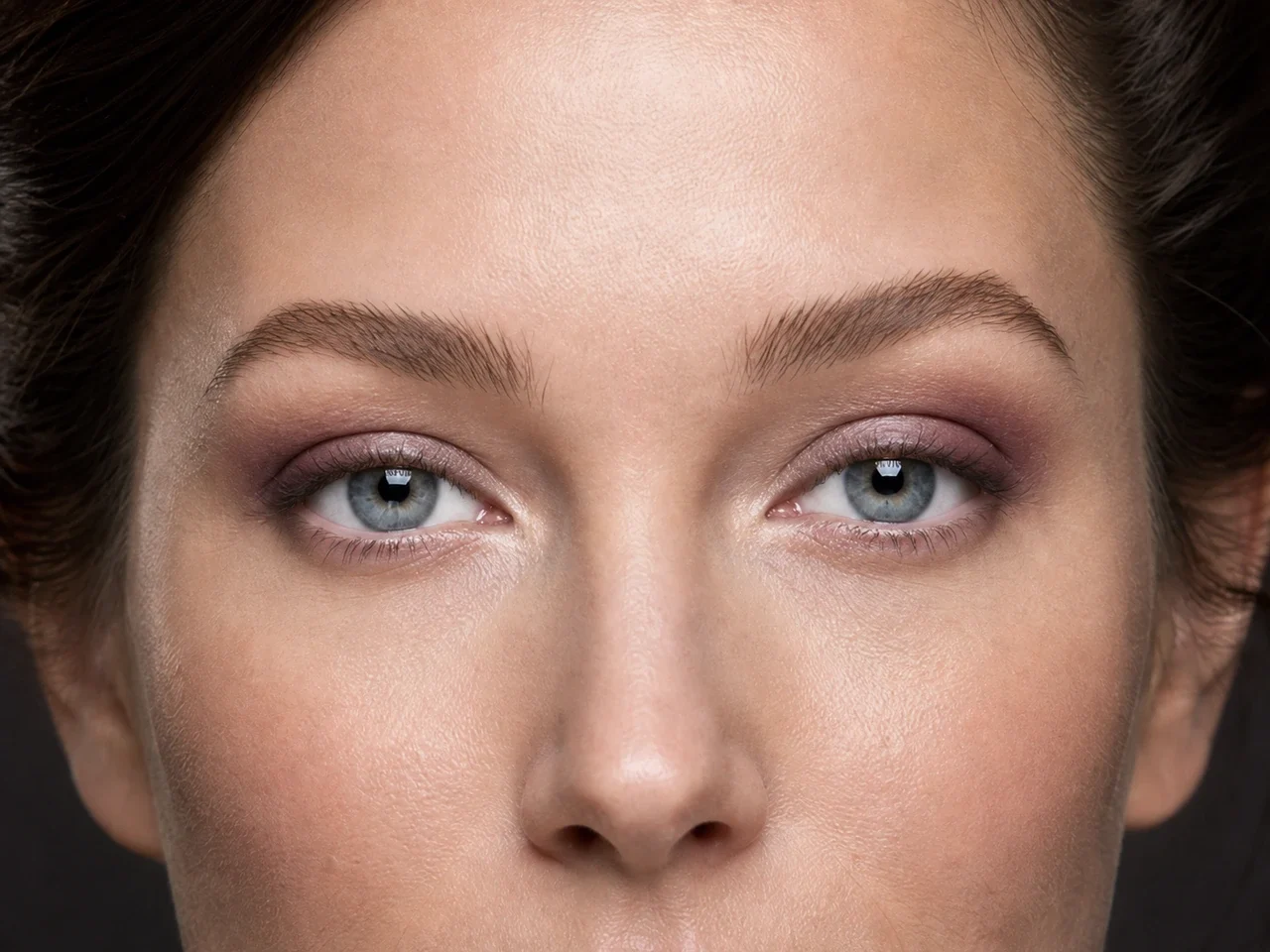 Step 5 of Elegant Dinner Party Makeup, showing soft plum makes the lashes look denser while the eye color and lid space stay visible.