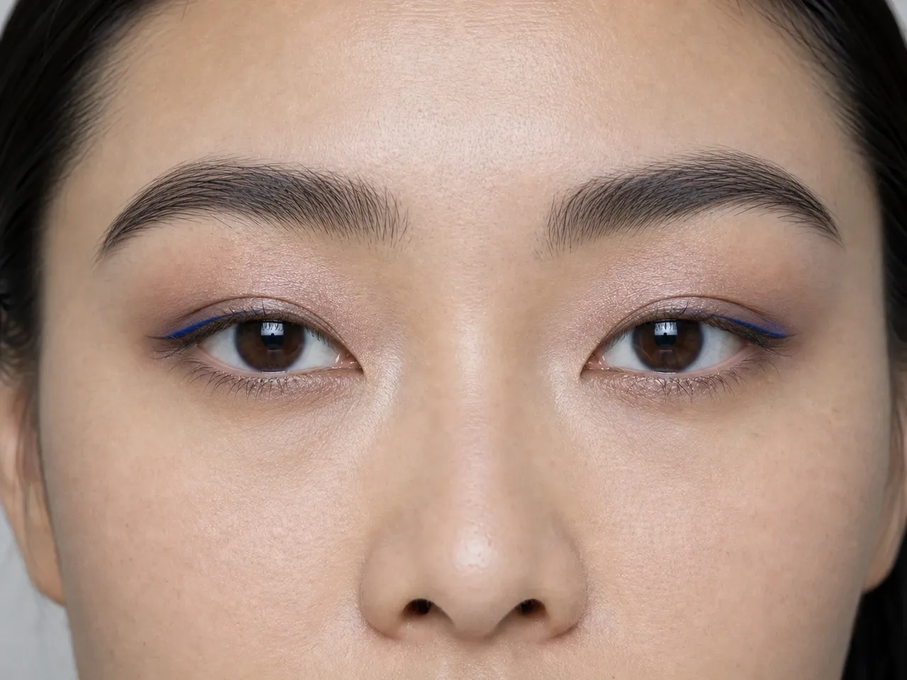 Step 5 of Soft Glam for Hooded Eyes, showing cobalt micro-liner makes the upper lashes look denser without hiding the focal lid shade.