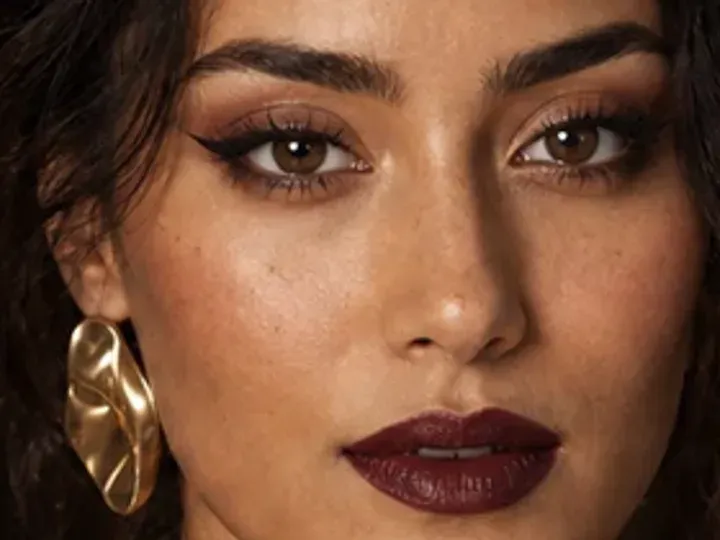 Step 5 of Elegant Dinner Party Makeup, showing soft plum makes the lashes look denser while the eye color and lid space stay visible.