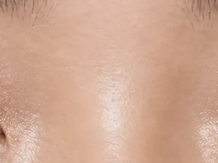 Step 5 of Soft Shimmer Makeup for Monolids, showing cocoa matte makes the upper lashes look denser without hiding the focal lid shade.