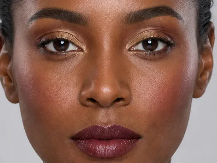 Step 5 of Rich Berry and Gold Makeup for Deep Skin, showing deep berry makes the lashes look denser while the eye color and lid space stay visible.