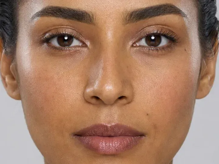 Step 5 of Neutral Soft Glam for Olive Skin, showing mauve brown makes the lashes look denser while the eye color and lid space stay visible.