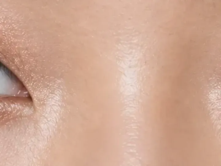 Step 6 of Soft Shimmer Makeup for Monolids, showing a restrained lower-lash echo connects the palette without closing the inner corner or pulling the eye down.