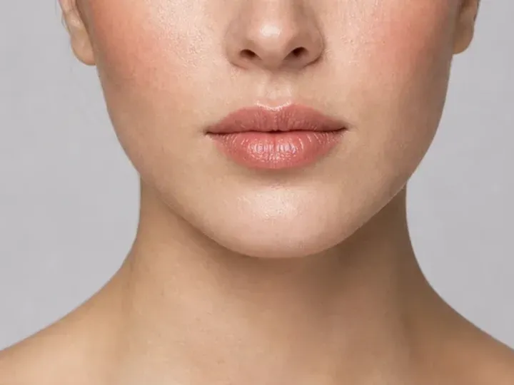 Step 6 of Warm Peach Makeup for Fair Skin, showing pink peach is visible at upper cheek and lips while natural skin still shows through the edges.