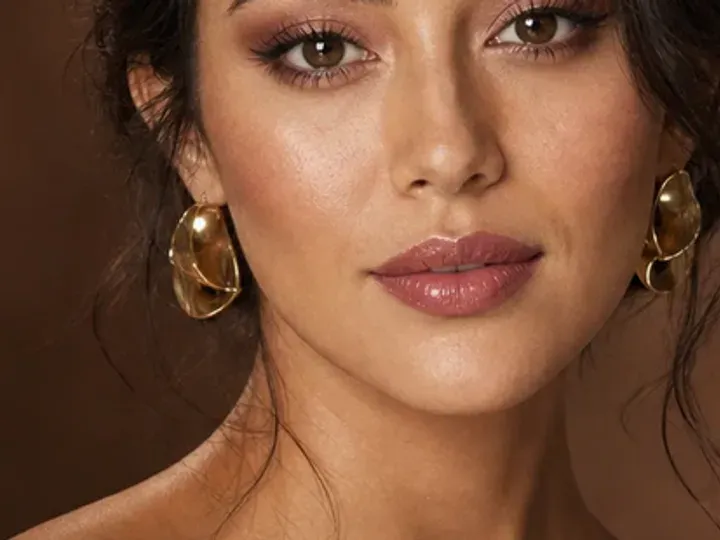 Step 6 of Soft Glam Wedding Guest Makeup, showing soft berry is visible at upper cheek and lips while natural skin still shows through the edges.