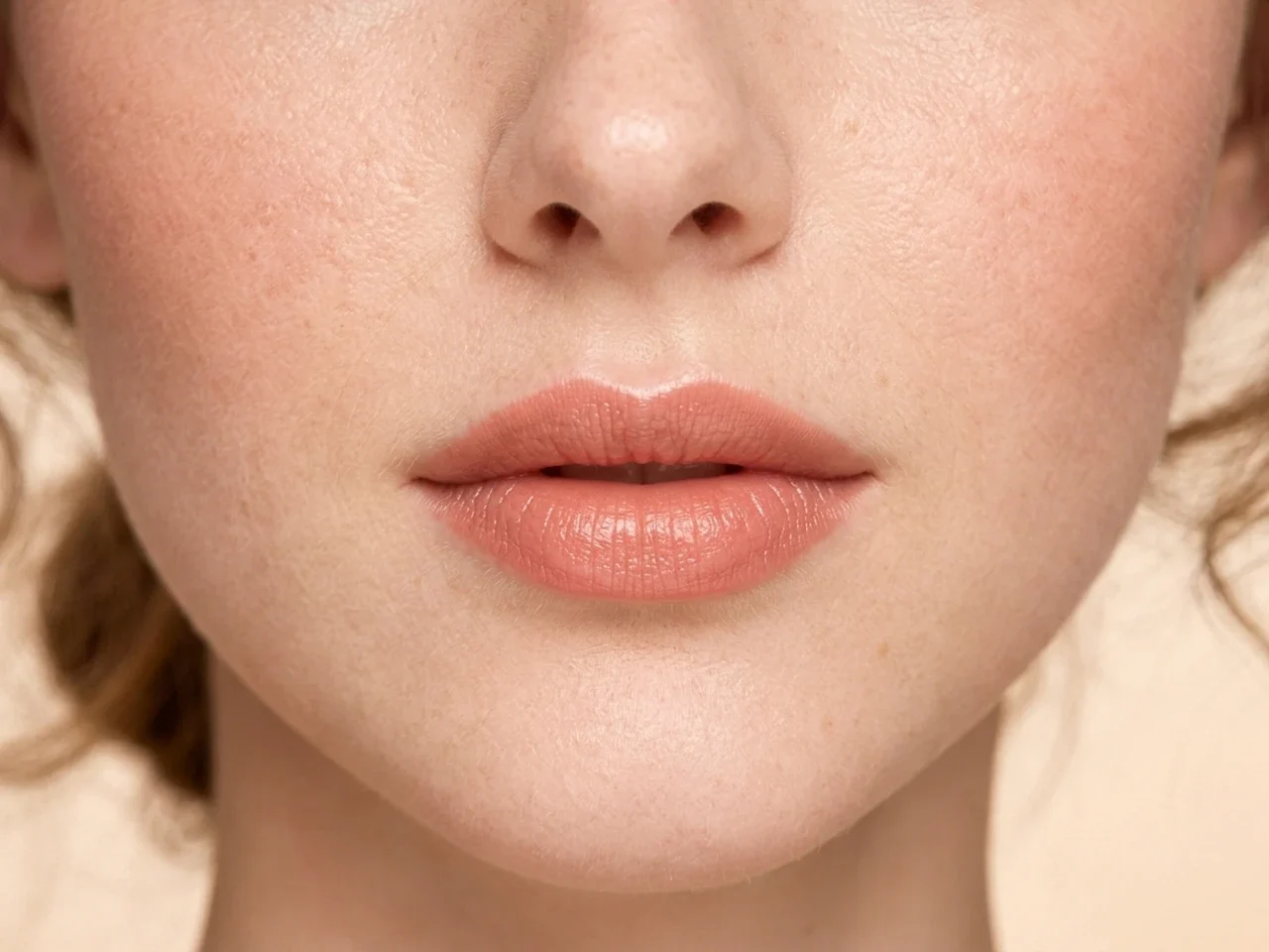 Step 7 of Warm Peach Makeup for Fair Skin, showing the lip shows Pink peach in harmony with Pink peach and the fresh satin finish without becoming the only focal point.