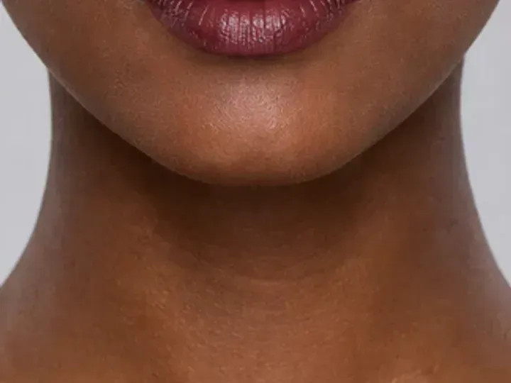 Step 7 of Rich Berry and Gold Makeup for Deep Skin, showing the lip supports Deep berry and the rich luminous finish without becoming the only focal point.