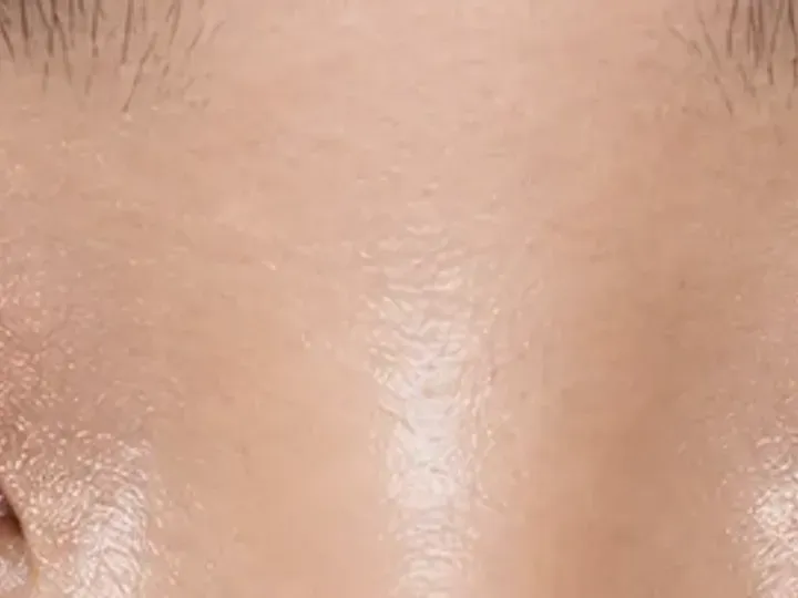 Step 7 of Soft Shimmer Makeup for Monolids, showing the center and outer lashes lift clear of the lid and remain individually separated.