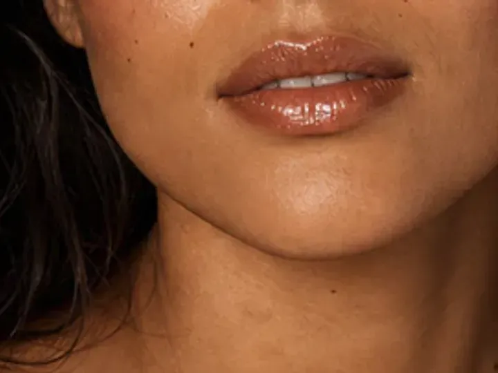 Step 7 of Easy Vacation Makeup, showing the lip supports Sheer bronze and the sheer sunlit finish without becoming the only focal point.